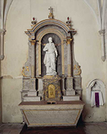 ensemble de l'autel secondaire de saint Joseph : autel, tabernacle architecturé à niche, retable